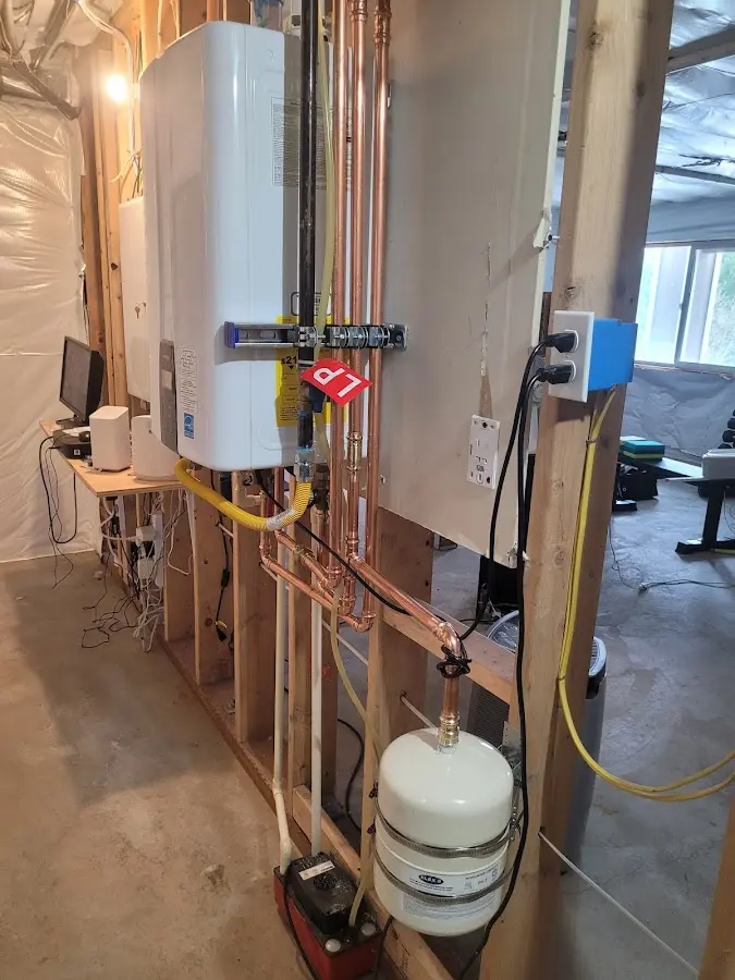 Licensed plumber repairing a kitchen sink in Wood-Ridge